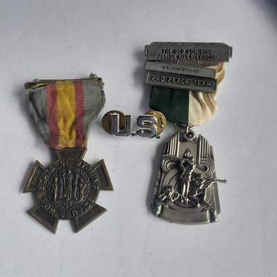 Two military badges and US hat pin