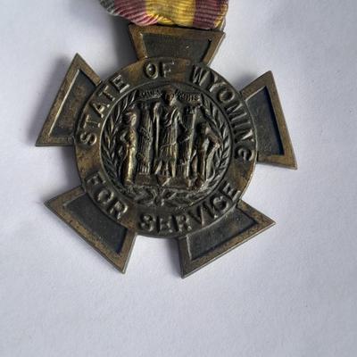 Two military badges and US hat pin