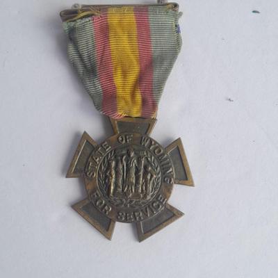 Two military badges and US hat pin