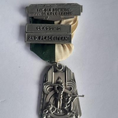 Two military badges and US hat pin
