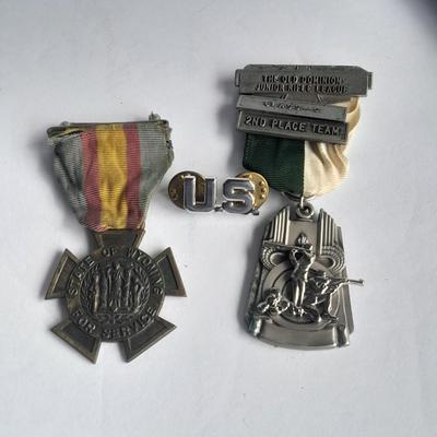 Two military badges and US hat pin