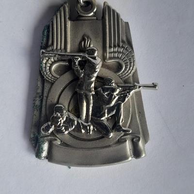 Two military badges and US hat pin