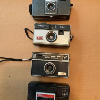 Three vintage Kodak Cameras and one Imperial.