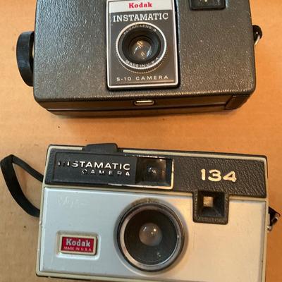 Three vintage Kodak Cameras and one Imperial.