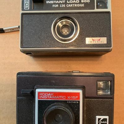 Three vintage Kodak Cameras and one Imperial.