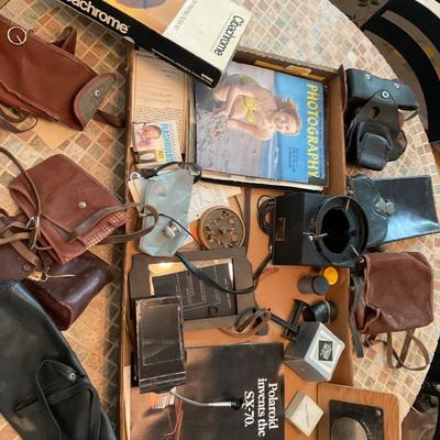 Camera bags and camera parts.