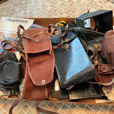 Camera bags and camera parts.