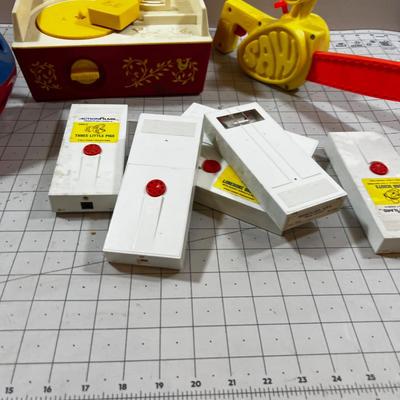 Mixed Lot Fisher Price Action Films and Record Player,  Chain Saw and a shape Ball  