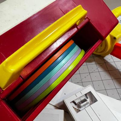 Mixed Lot Fisher Price Action Films and Record Player,  Chain Saw and a shape Ball  