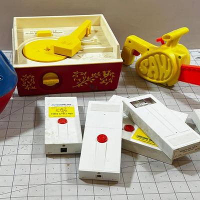 Mixed Lot Fisher Price Action Films and Record Player,  Chain Saw and a shape Ball  