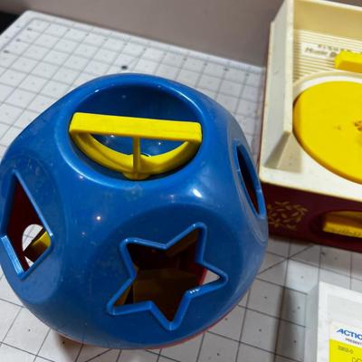 Mixed Lot Fisher Price Action Films and Record Player,  Chain Saw and a shape Ball  