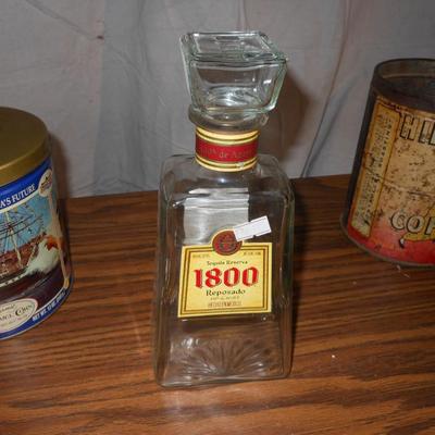 A COLLECTION OF TINS AND OLD BOTTLES