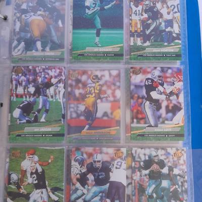 3 ring binder of Football cards, over 20 pages Rules of the game book, and 1970's Football stars book