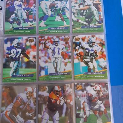 3 ring binder of Football cards, over 20 pages Rules of the game book, and 1970's Football stars book