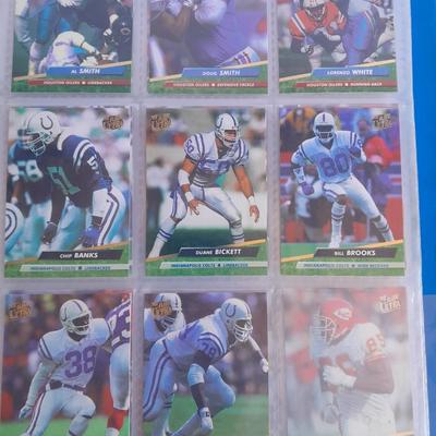 3 ring binder of Football cards, over 20 pages Rules of the game book, and 1970's Football stars book