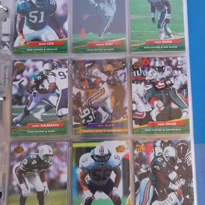 3 ring binder of Football cards, over 20 pages Rules of the game book, and 1970's Football stars book