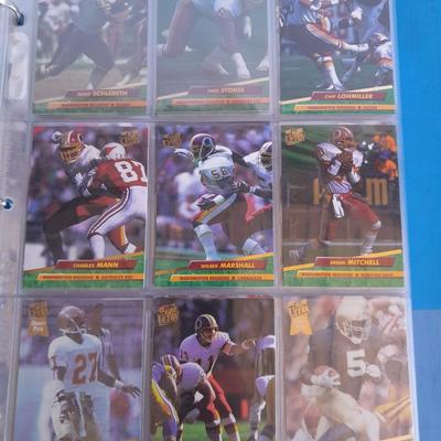 3 ring binder of Football cards, over 20 pages Rules of the game book, and 1970's Football stars book