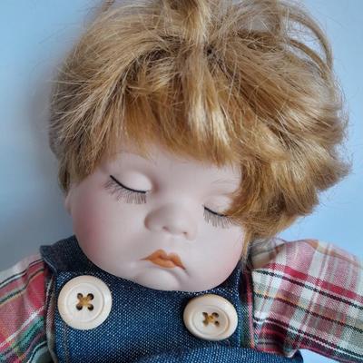 Two vintage porcelain dolls The Emerald Doll collection and a Heritage doll