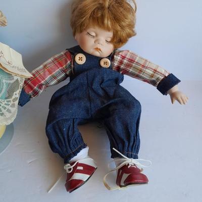 Two vintage porcelain dolls The Emerald Doll collection and a Heritage doll