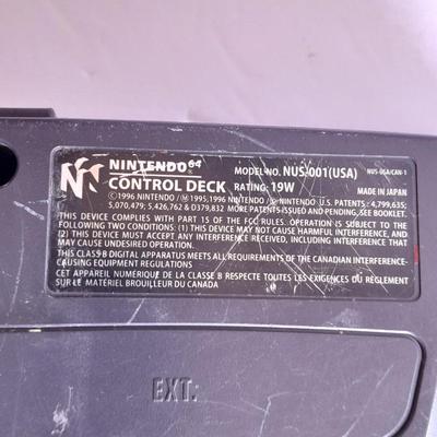 Nintendo 64 with controllers, Nine games, cords, and more