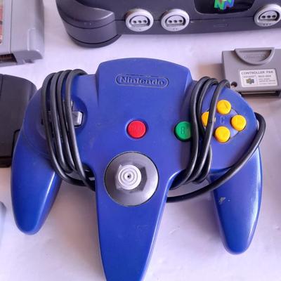 Nintendo 64 with controllers, Nine games, cords, and more