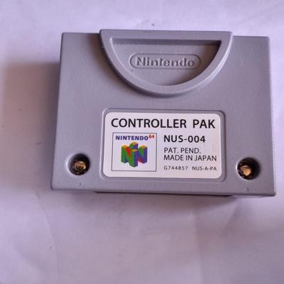Nintendo 64 with controllers, Nine games, cords, and more