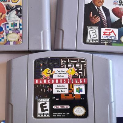 Nintendo 64 with controllers, Nine games, cords, and more