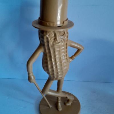 Advertisement Piggy banks Coin banks Mr. Peanut, Apple. Tootsie rolls, and Coke