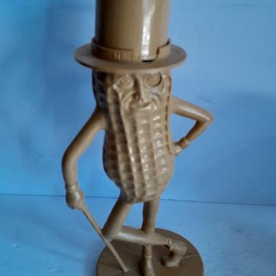 Advertisement Piggy banks Coin banks Mr. Peanut, Apple. Tootsie rolls, and Coke