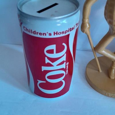 Advertisement Piggy banks Coin banks Mr. Peanut, Apple. Tootsie rolls, and Coke