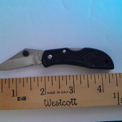 Two knives, double bladed and small black pocketknife