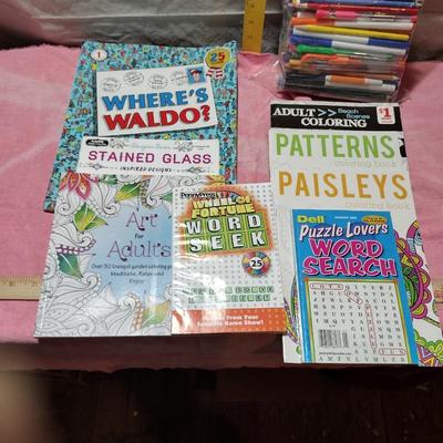 WORD SEARCH, ADULT COLORING BOOKS AND A BAG OF PENS AND MARKERS