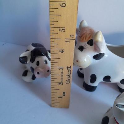 Holstien Cow Kitchen collectibles salt & pepper. creamer and Figures