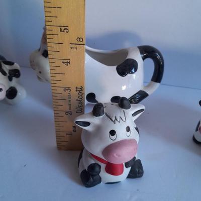 Holstien Cow Kitchen collectibles salt & pepper. creamer and Figures
