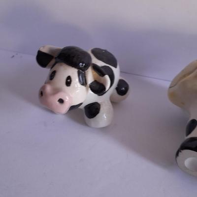 Holstien Cow Kitchen collectibles salt & pepper. creamer and Figures