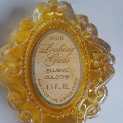 Avon collectible bottles, Item's you would find on a vanity. Mirror, vase, flower and more