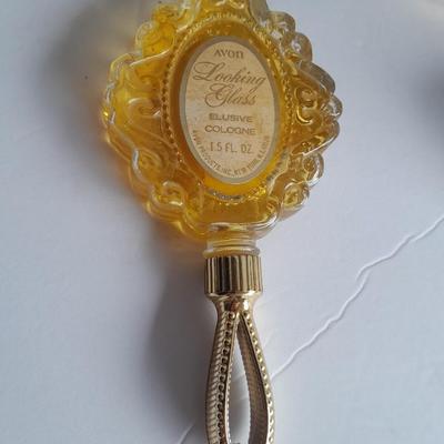 Avon collectible bottles, Item's you would find on a vanity. Mirror, vase, flower and more