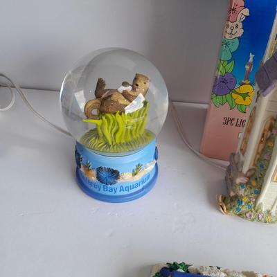 Collectibles Tic Tac Toe, illuminated church, cow ornament, otter snow globe and Hummingbird tea set
