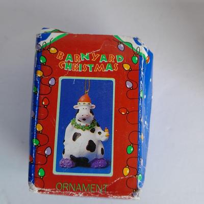 Collectibles Tic Tac Toe, illuminated church, cow ornament, otter snow globe and Hummingbird tea set