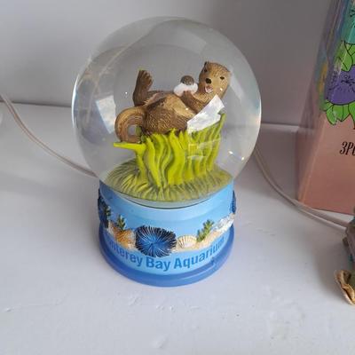 Collectibles Tic Tac Toe, illuminated church, cow ornament, otter snow globe and Hummingbird tea set