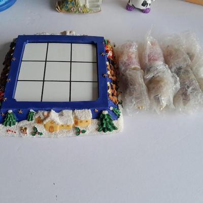 Collectibles Tic Tac Toe, illuminated church, cow ornament, otter snow globe and Hummingbird tea set
