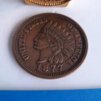 Indian head Penny Avon commemorative bottle, and large coin with Coin book and one Indian head penny