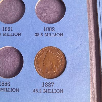 Indian head Penny Avon commemorative bottle, and large coin with Coin book and one Indian head penny