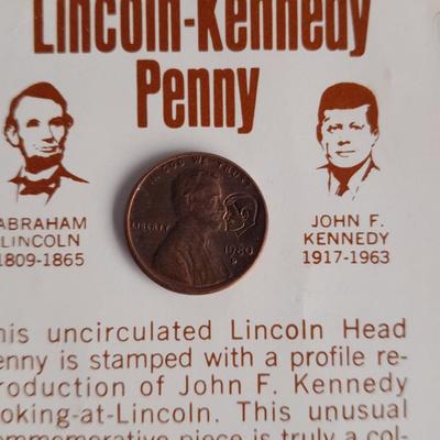 Two unopened 2004 United States Louisianna Purchase Five-Cent coins and a Lincoln - Kennedy Penny