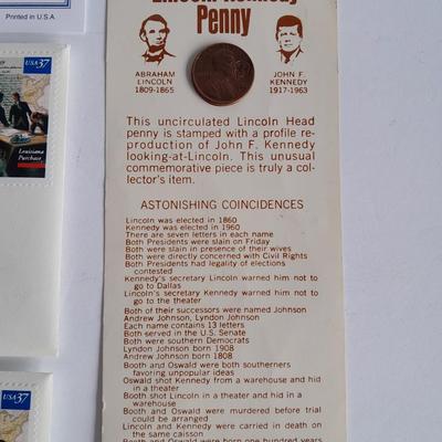 Two unopened 2004 United States Louisianna Purchase Five-Cent coins and a Lincoln - Kennedy Penny