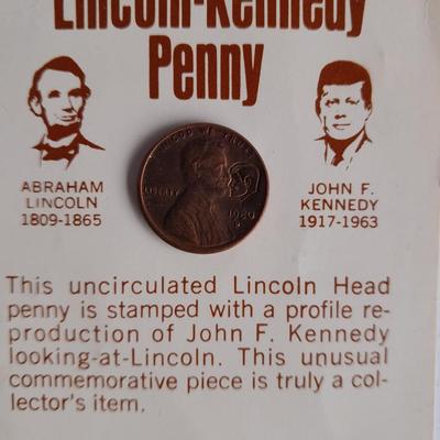 Two unopened 2004 United States Louisianna Purchase Five-Cent coins and a Lincoln - Kennedy Penny