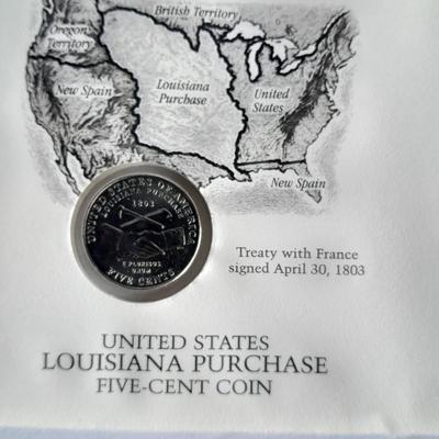 Two unopened 2004 United States Louisianna Purchase Five-Cent coins and a Lincoln - Kennedy Penny