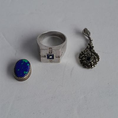 Sterling Silver .925 Men's ring, pendant .925 marked and small set gemstone .925 marked.