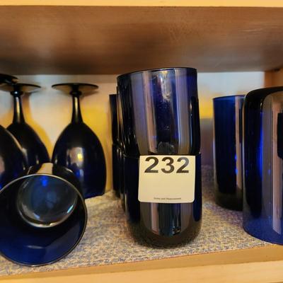Collection of Blue Glasses Middle Shelf of Cabinet