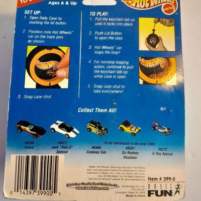 Hot wheels Keychain with assortment of other small cars and a motorcycle